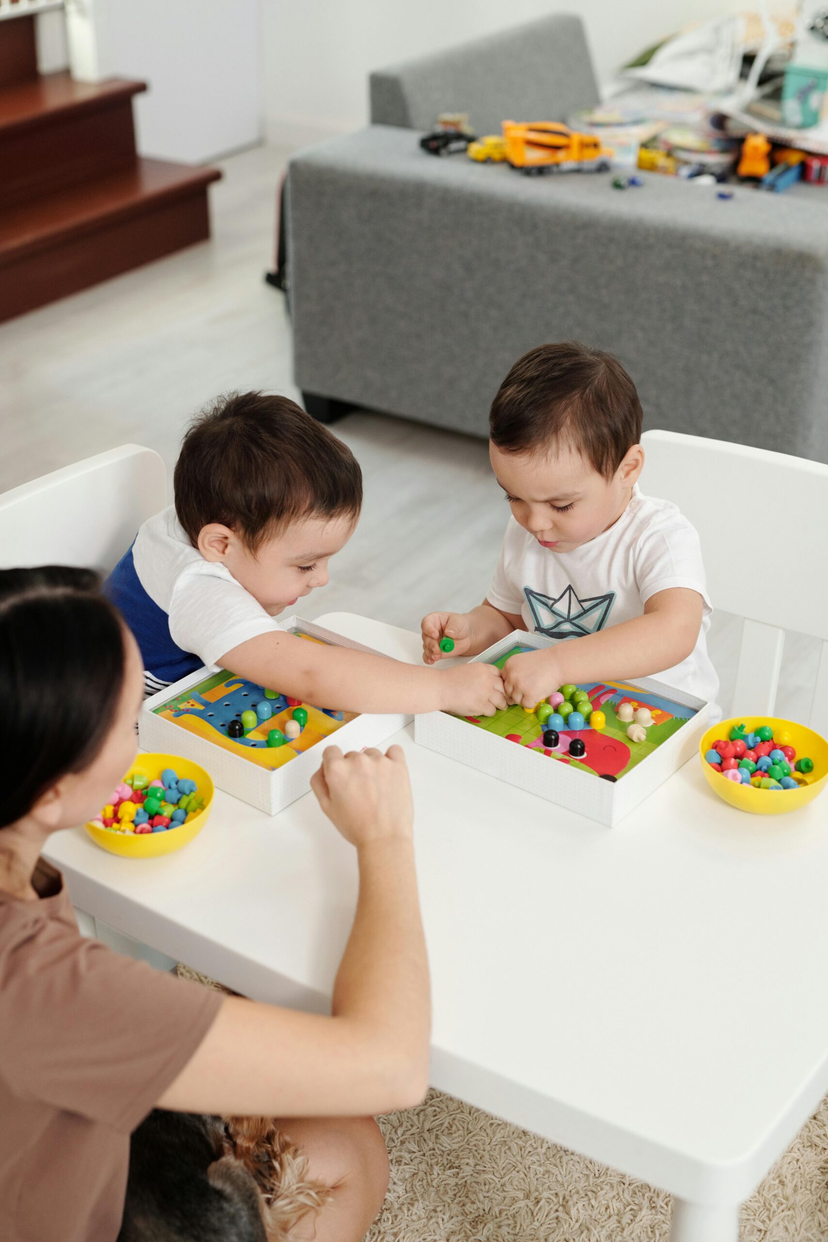 toddlers playing on table